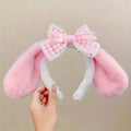 Pink bunny ears headband with lace bow and plush ear covers