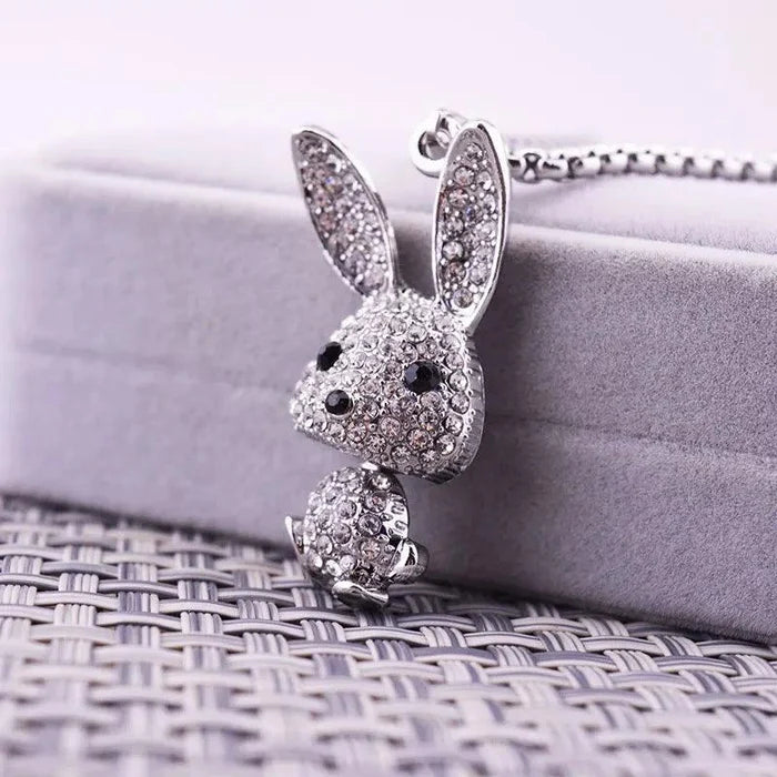 Rhinestone bunny pendant necklace featuring silver-tone rabbit head and tail charm