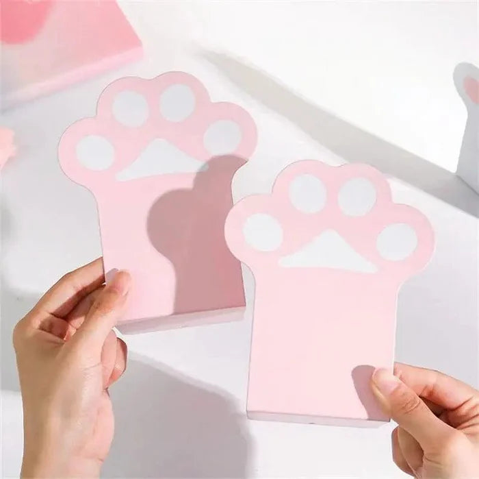 Cat paw bookend pair held upright, pink base with white paw emblem