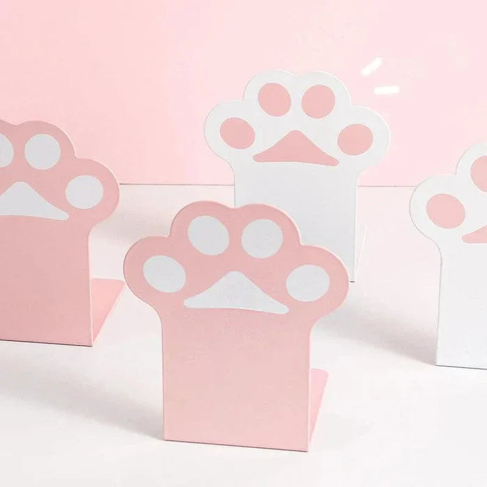 Three cat paw bookends with pink bases and white paw emblems, desk organizer