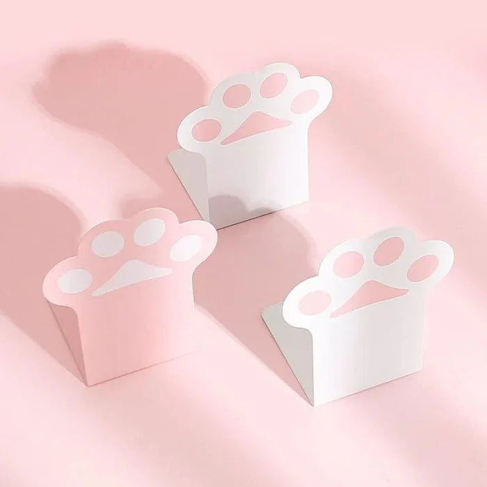 Cat paw bookends set, white paw shapes on pink backing, three-piece arrangement
