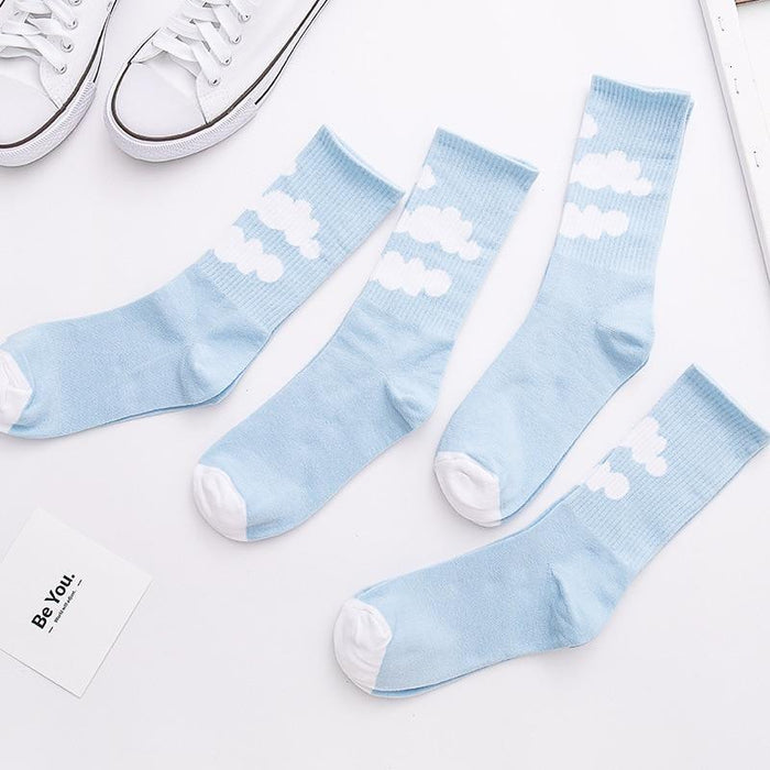 Light blue ankle socks with white cloud pattern, ribbed knit cuffs and white toe