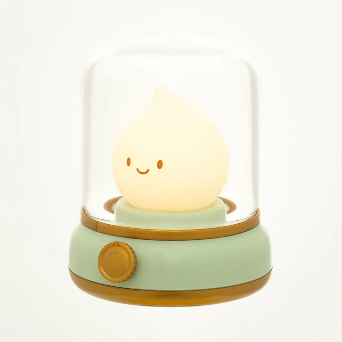 Green flame night light with glowing smiling teardrop bulb under white dome