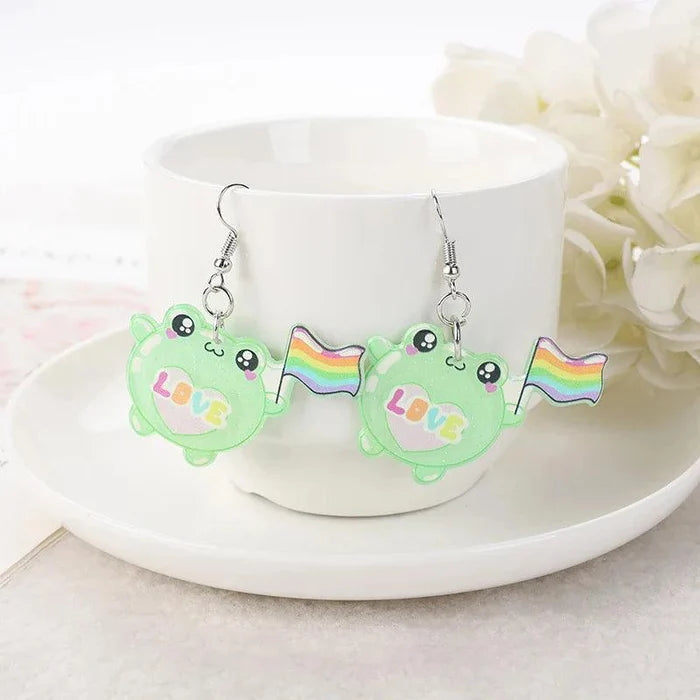 Green frog face acrylic dangle earrings with rainbow flag and 'Love' charm