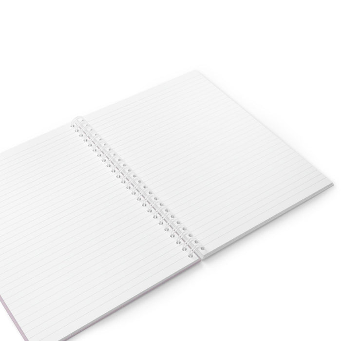 Lined spiral notebook with white paper pages and silver coil binding