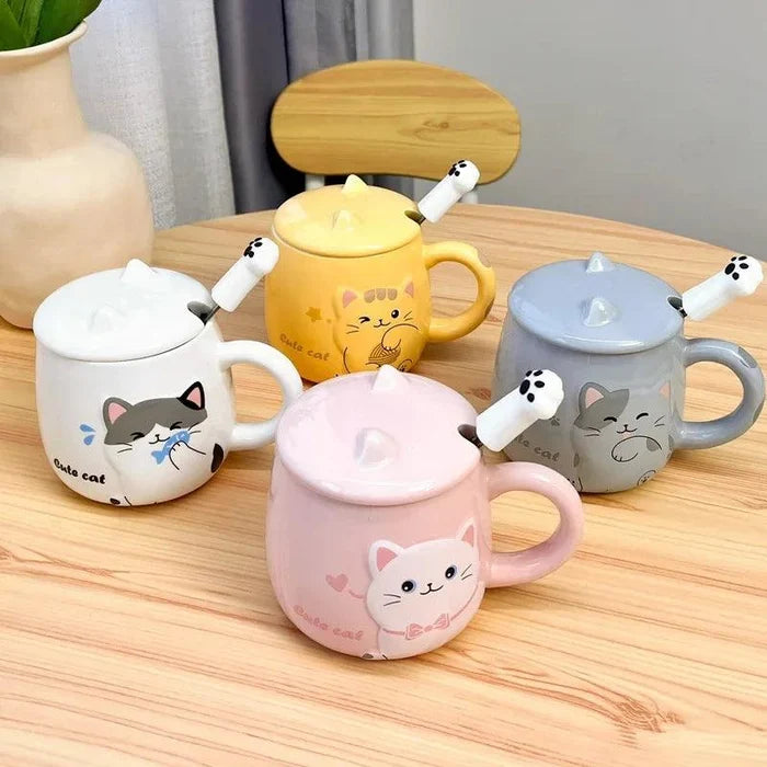 Collection of pastel cat lidded mugs with different colors on a wooden table