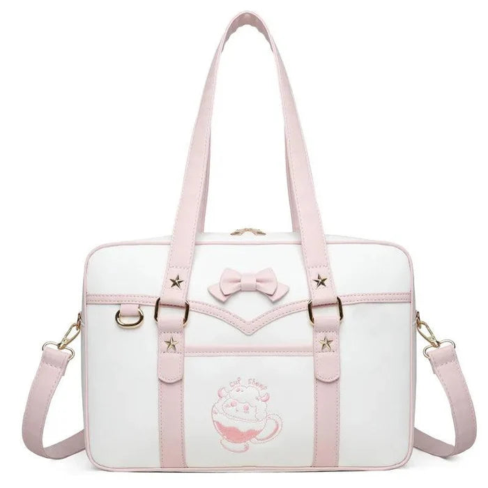 Light-pink and white messenger bag with bow front, star accents, top handles, and strap