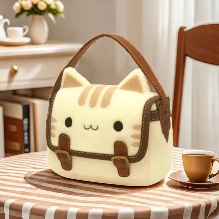 Cat face mini handbag in cream plush with brown trim and top handle.