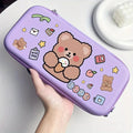 Purple hard shell gaming bag with bear cartoon, food icons, and zipper closure along top edge