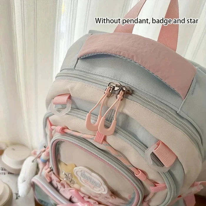 Light gray and pastel pink backpack with side zipper pocket and adjustable straps.