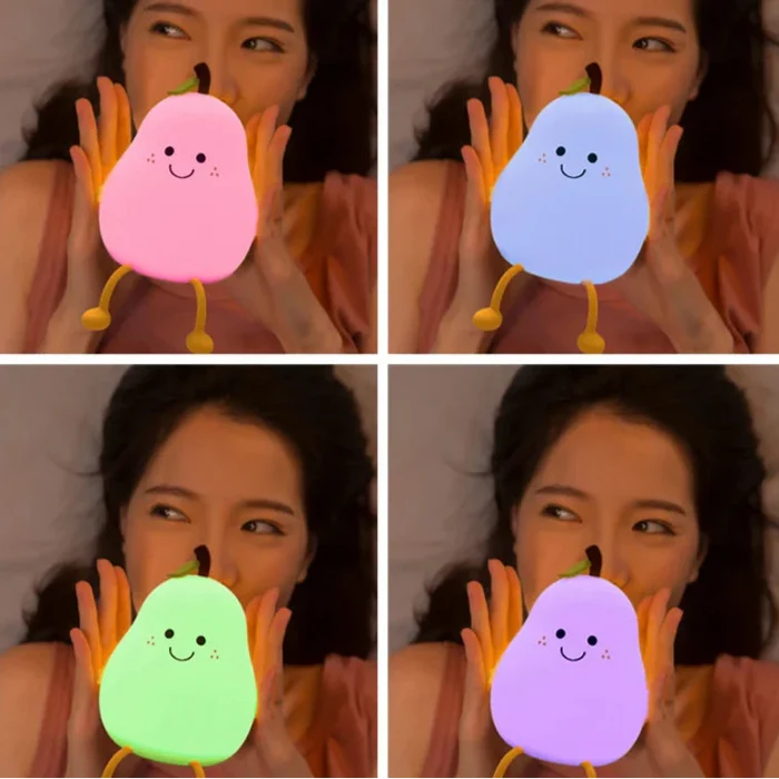 Peach-shaped night lights in pink, blue, green, and purple, held by hands