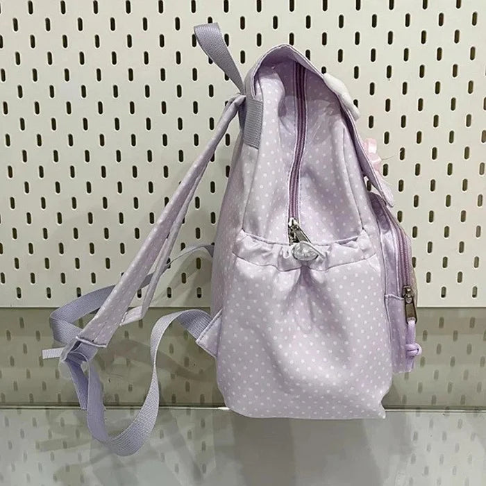 Lilac polka dot backpack with adjustable shoulder straps and top handle