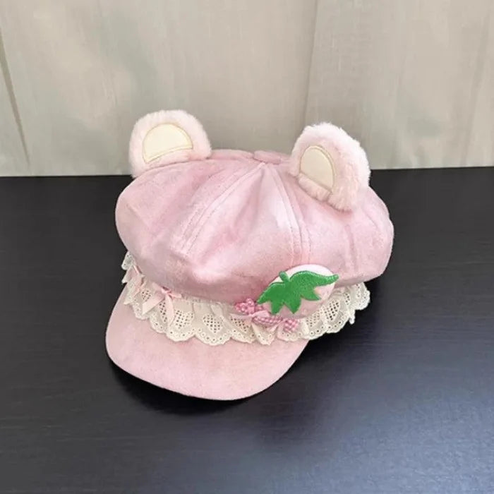 Pink bear-ear cap with strawberry appliqué, gingham bow, and scalloped lace trim