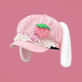 Pink strawberry bunny hat with green strawberry applique, lace ruffle band, and white ears