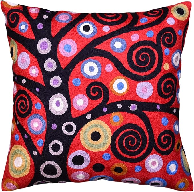 Red and black decorative pillow cover with colorful swirling circular patterns.