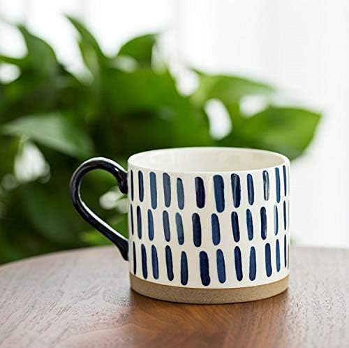 Blue line-pattern porcelain mug with black handle and tan base ring
