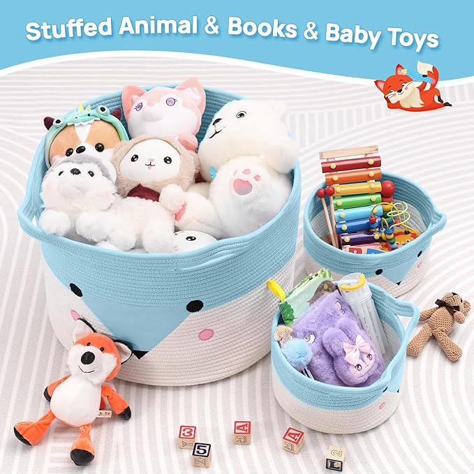 Woven baby storage baskets with blue-and-white animal face, filled with plush toys and blocks.
