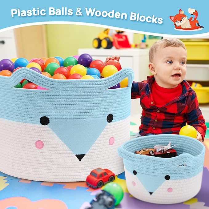 Woven baby toy baskets with blue-and-white animal face design, holding colorful plastic balls.