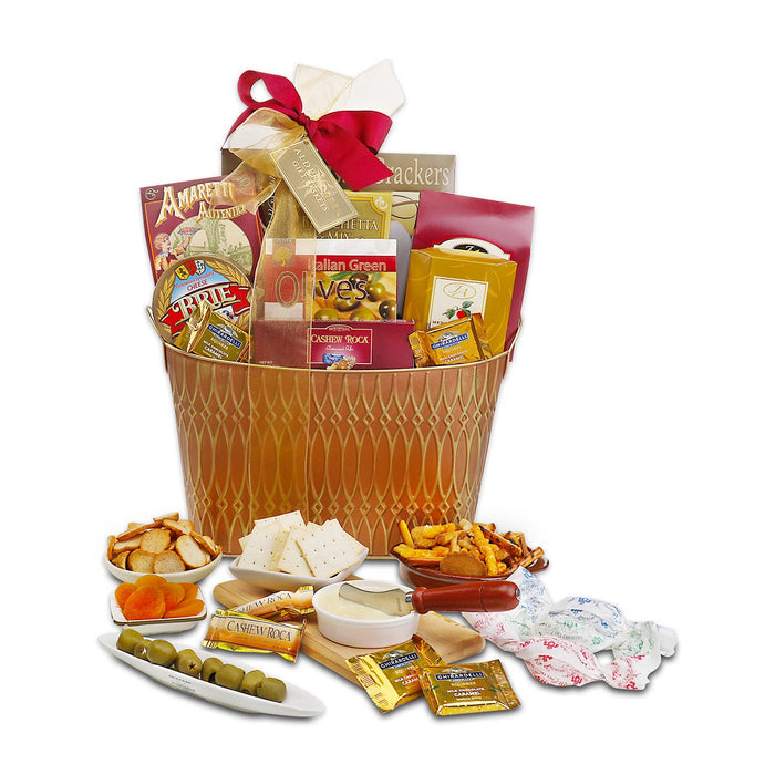 Gift basket in gold wicker with assorted snacks and cheese, crackers, and olives; red ribbon