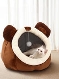 Brown and cream bear-ear cat bed cave with plush round opening, hanging ball inside