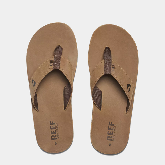 Reef Leather Smoothy Flip Flops in brown with leather straps and textured footbed, top view.
