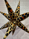 Leopard print starburst balloon cluster with five pointed foil balloons