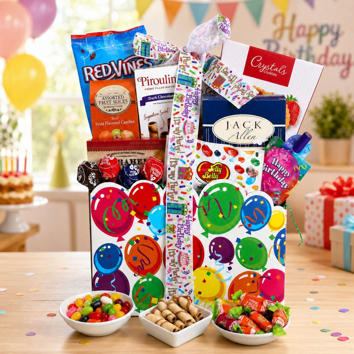 Birthday treats gift basket with colorful wrapped candies and snack bowls