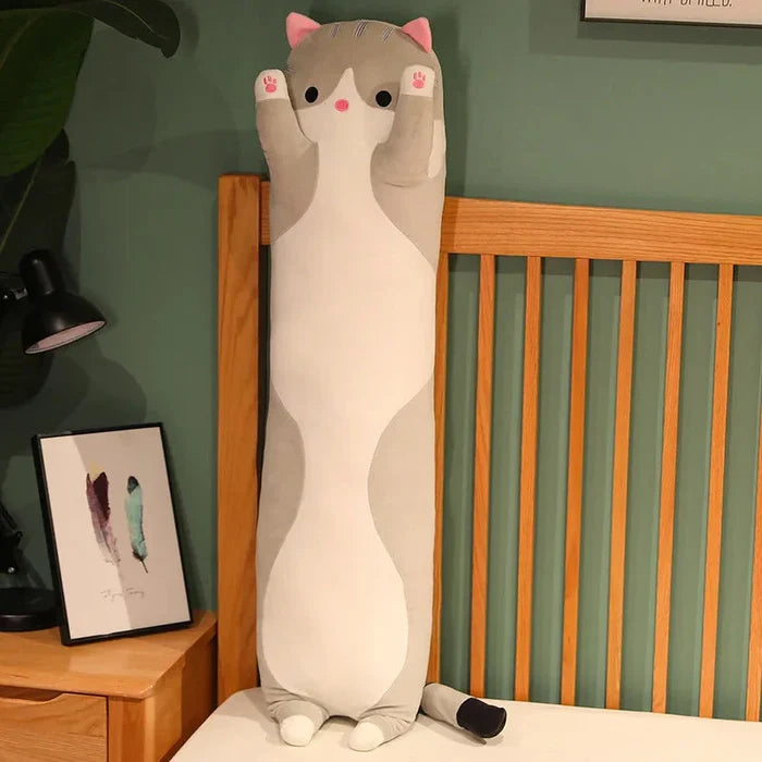 Cream cat plush pillow, pink nose and paw pads, tall standing cat shape, soft plush.