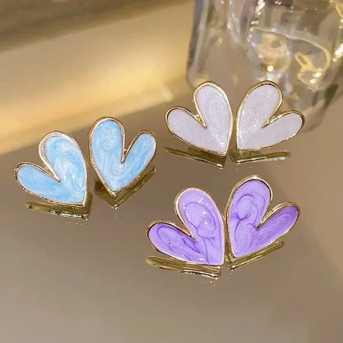 Gold-tone heart earrings with blue and purple enamel heart designs