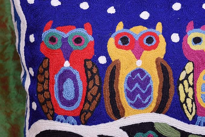 Blue wool lumbar pillow cover close-up of embroidered owls and white dotted pattern