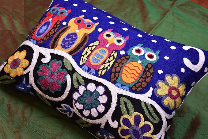 Blue embroidered wool lumbar pillow cover with owl and flower panels on white trim