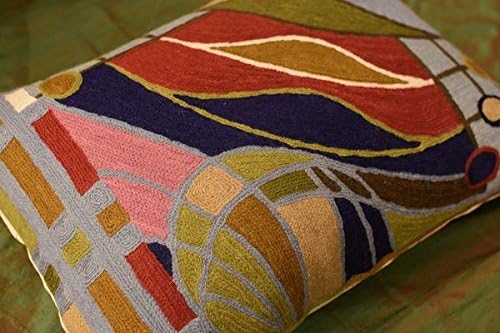 Lumbar pillow cover corner detail with curved stripes, tan circle motif, and grid