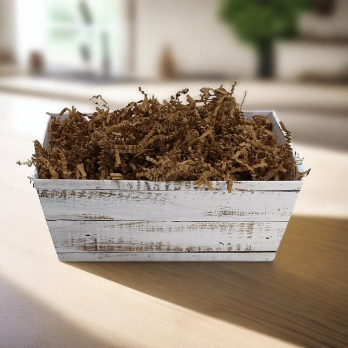 Breakfast gift basket with shredded brown filler in a white distressed tray