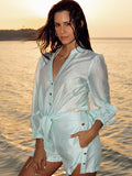 Model wearing the Martinique beach shirt and shorts in aqua by NAIA Beach