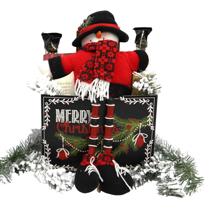 Deluxe Christmas gift box with red nutcracker in black hat, wrapped chocolates and gifts