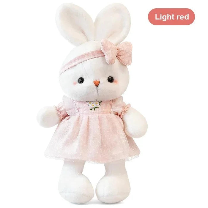 Pink bunny plush doll with bow headband and ruffled dress with flower embroidery