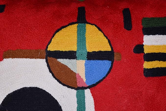 Red wool throw pillow cover close-up of multicolor circle and striped rectangles