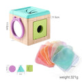 Cloth busy box tissue toy cube with round handle opening and stacked translucent scarves