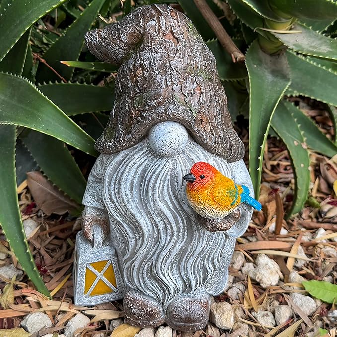 Garden gnome figurine with orange-and-yellow bird perched on a gray swirled robe.