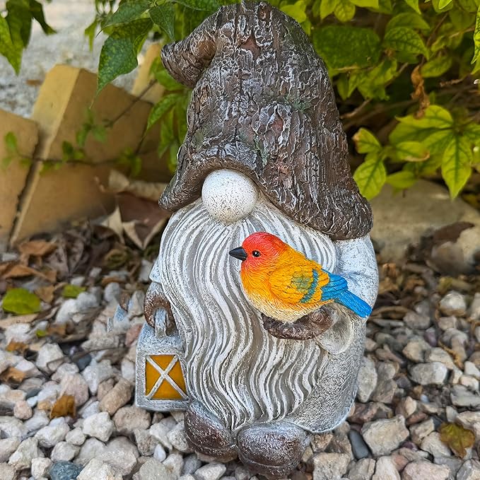 Garden gnome figurine with orange bird perched on gray swirled robe and star lantern.