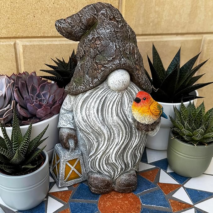 Garden gnome figurine with orange bird, gray swirled robe, and yellow star lantern.