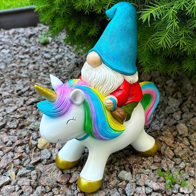 Outdoor unicorn statue with rainbow mane and gnome rider holding reins, gold hooves