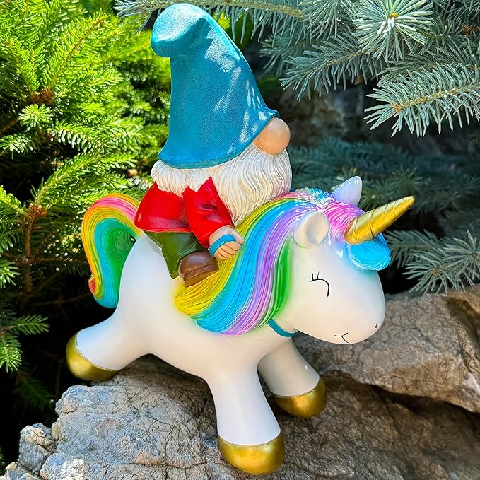 Unicorn lawn decoration with rainbow hair, blue hat gnome rider, red tunic and gold feet
