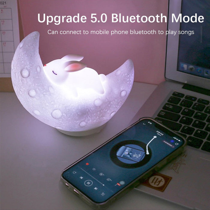White moon bunny night light speaker with a bright soft glow, crescent moon body shape