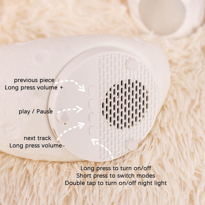 White moon bunny night light speaker control panel with speaker grille and button icons