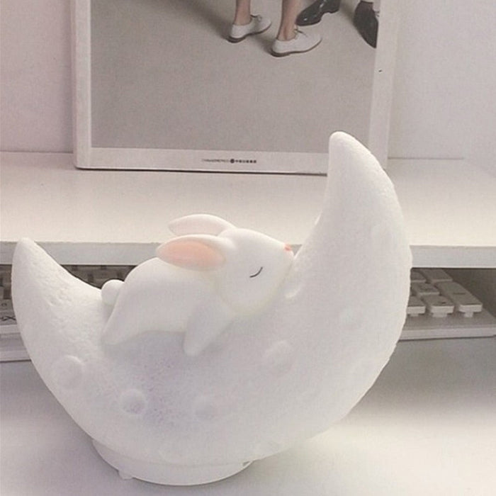 White moon bunny night light speaker with a warm glow, lying bunny and crescent base