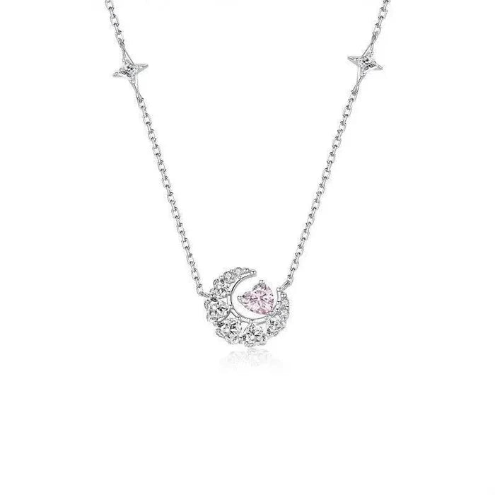 Silver-tone pendant necklace with star charm motifs and a pink zircon heart pendant