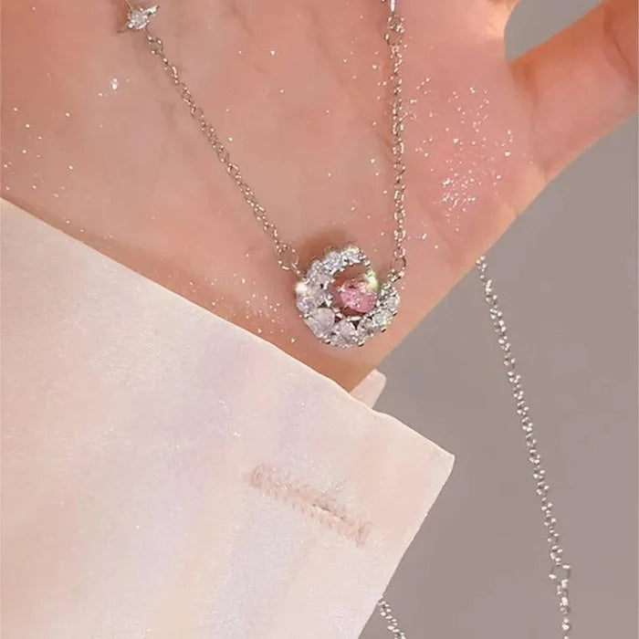 Silver-tone chain necklace with pink heart zircon pendant in a halo of clear stones