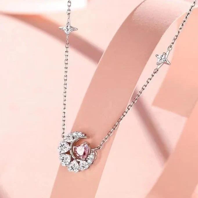 Silver-tone star charm pendant necklace with round pink zircon in glittering halo
