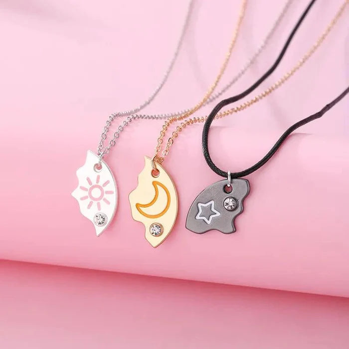 Friendship necklace set with sun, moon, and star pendants on silver, gold, and black chains